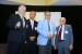 Professor T. Grandon Gill, Chair of the Award Ceremony, Professor Hsing-Wei Chu, Program Committee Co-Chair, and Dr. Nagib Callaos, General Chair, giving Dr. Ronald Styron a plaque "In Appreciation for A Great Keynote Address at a Plenary Session."